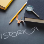 The word story is written on a desk and an arrow pointing at a book