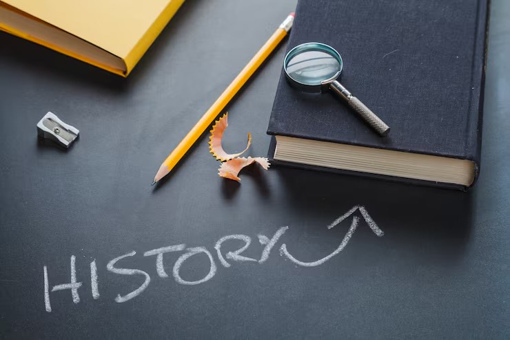 The word story is written on a desk and an arrow pointing at a book