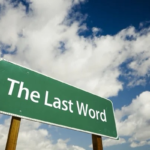 A sign saying "The Last Word" in front of the sky