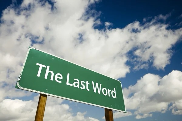A sign saying "The Last Word" in front of the sky