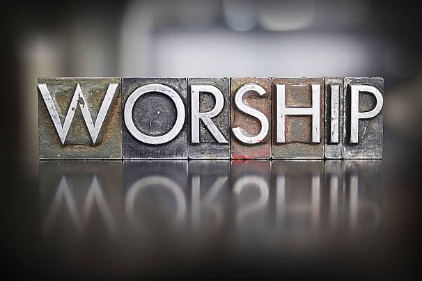 The word 'Worship' spelled out in wooden inkstamp blocks
